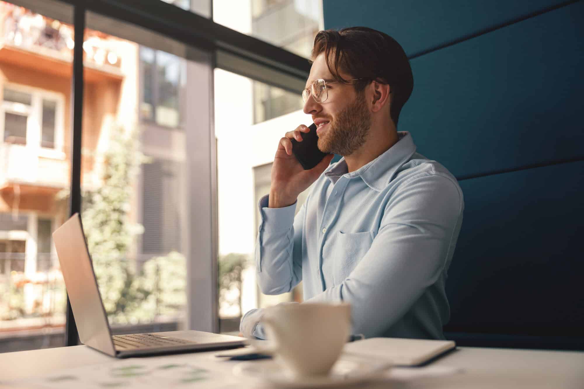 A man on the phone using the HMRC self-assessment helpline